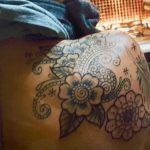 Girl with a black back tattoo before laser tattoo removalLaser Tattoo Removal Campbelltown Sydney's Leading Pico Clinic